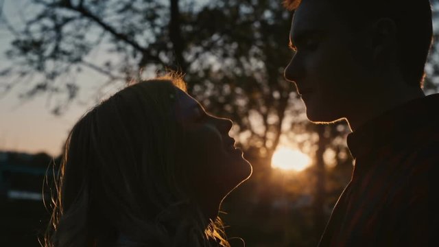 Young romantic couple first kiss