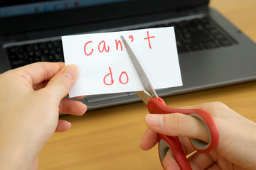 holds card with text can't do on computer