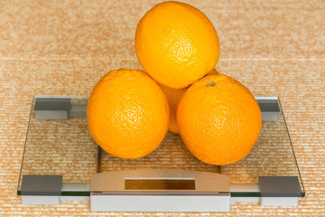oranges  on digital weightig scale