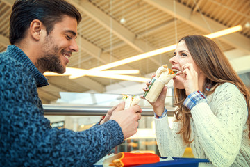 Couple eating in fast food restaurant