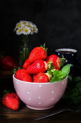 Bowl with strawberry, still life dark photography