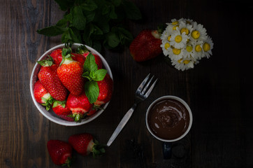 Bowl with strawberry, still life dark photography