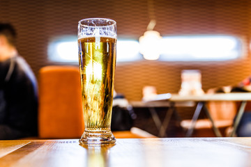 cold beer glass on bar or pub desk