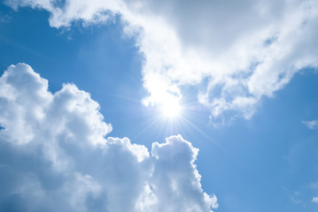 Sun between the clouds against the sky.