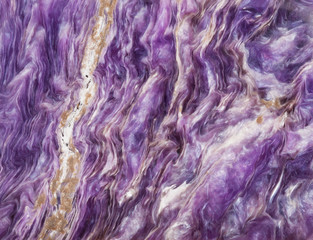 background from tumbled charoite gemstone