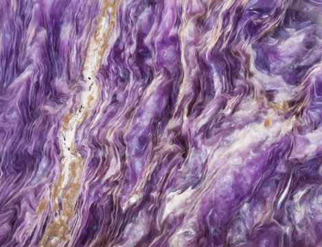 background from tumbled charoite gemstone