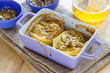 Baked apple with honey and pistachio nuts