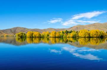 Autumn reflections at Wairepo Arm, Lake Ruataniwha in New Zealand.