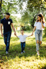 Young family spending holiday in park