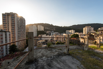 Fototapeta na wymiar Apartments and Houses Between the Hills of Rio de Janeiro in Laranjeiras Neighborhood