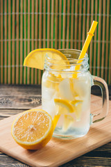 Lemonade with Fresh Lemon. Healthy Food and Drink Concept