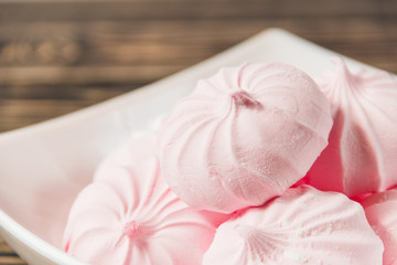 Obraz na płótnie Canvas Pink Marshmallows - Zephyr in White Plate. Sweet Dessert Concept