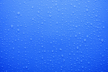 Naklejka na ściany i meble water drop on deep blue surface