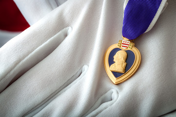 Purple heart presented with white gloves