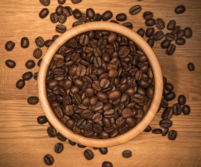 Coffee beans in a wooden bowl