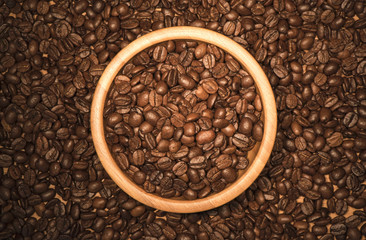 Coffee beans in a wooden bowl