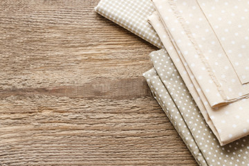 Fabrics on wooden background