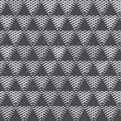 Monochrome triangles with grunge effect. Seamless pattern.