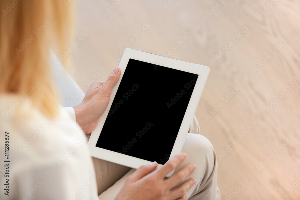 Poster cropped image of redhead woman using wireless high-speed internet connection on electronic tablet wi