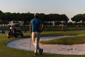 golfer from back at course looking to hole in distance