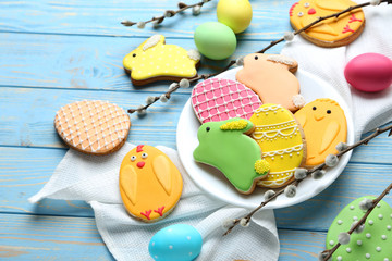 Colorful easter cookies on blue wooden background