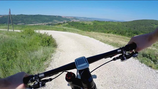Going down on mountain bike. Sunny day in a Chianti countryside. POV Original point of view
