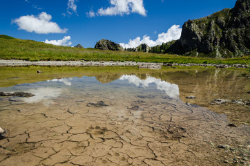 alps profile, scenic view of mountain peaks on italian alps with reflections