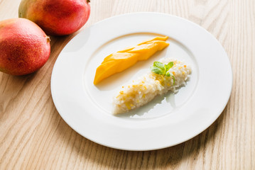 .Thai style tropical dessert, glutinous rice eat with mangoes