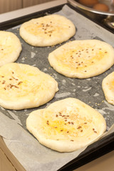 Pastry with sesame seeds ready for baking in the oven