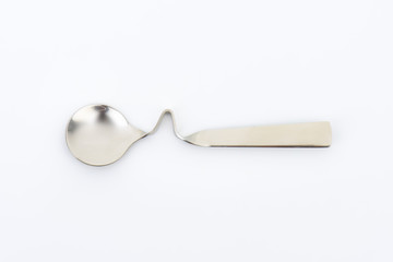 bent metal spoon