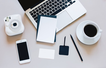 Creative flat lay photo of workspace desk with laptop, blank car