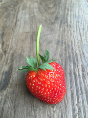 Fresh strawberries on old wooden background