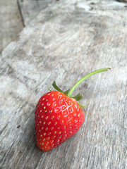 Fresh strawberries on old wooden background