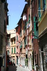 Fototapeta na wymiar Narrow old alley in Porto Venere at Ligurian sea, Italy