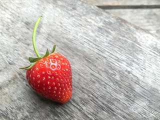 Fresh strawberries on old wooden background