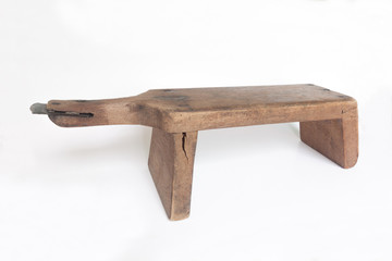 Old traditional coconut grater iisolated on white