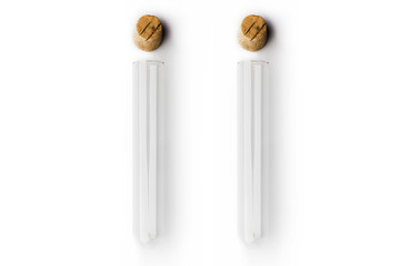 Two glass transparent test tubes with cork above on white background