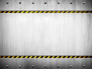 metal template with warning striped background - 111290216