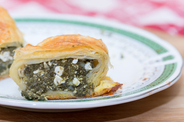 Homemade pie with spinach on a plate