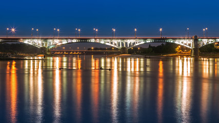 Fototapeta na wymiar Poniatowski Bridge in Warsaw by night