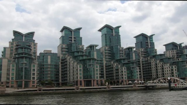 Dolly view of a contemporary riverside real estate development in West London