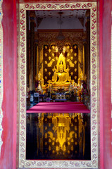 Golden buddha statue in church