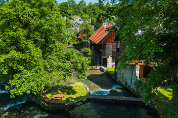 Fototapeta na wymiar Beautiful village of Rastoke near Slunj in Croatia, river Slunjcica, old water mills on waterfalls