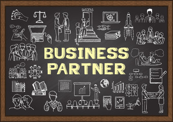 Hand drawn icons about BUSINESS PARTNER on chalkboard
