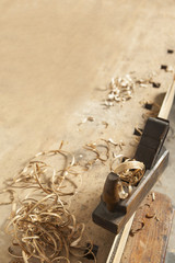 carpenters hand plane on wooden background.copy space