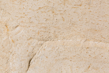 Rocky coast formed by sandy sediments.