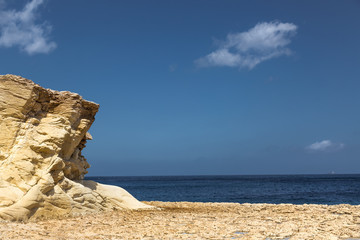 Fototapeta na wymiar Rocky beach in MarsaskalaRocky beach in Marsaskala gulf, Malta.