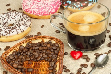 Fresh hot coffee and fresh donuts. Traditional sweets with coffee. Calorie junk food. Fresh unhealthy breakfast.

