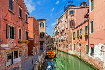 Fototapeta na wymiar Old houses and small canal in Venice.