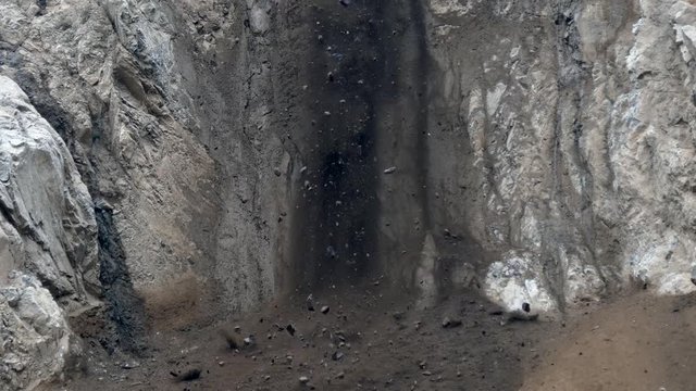 Rocks and boulders falling down hillside.